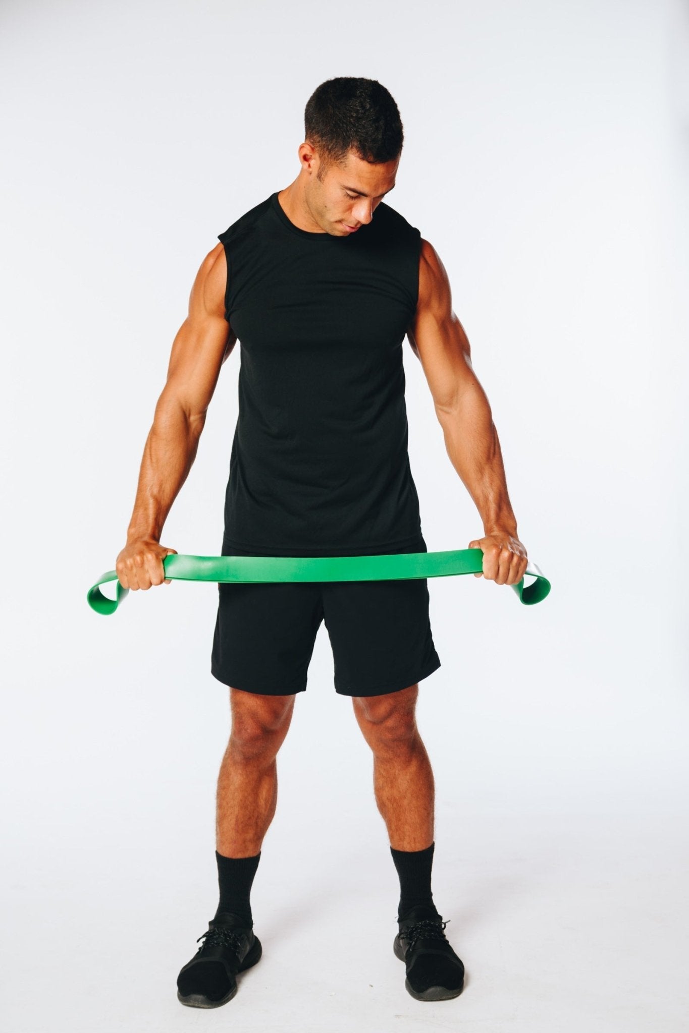 image of a fitness model holding a hyperwear super band resistance band