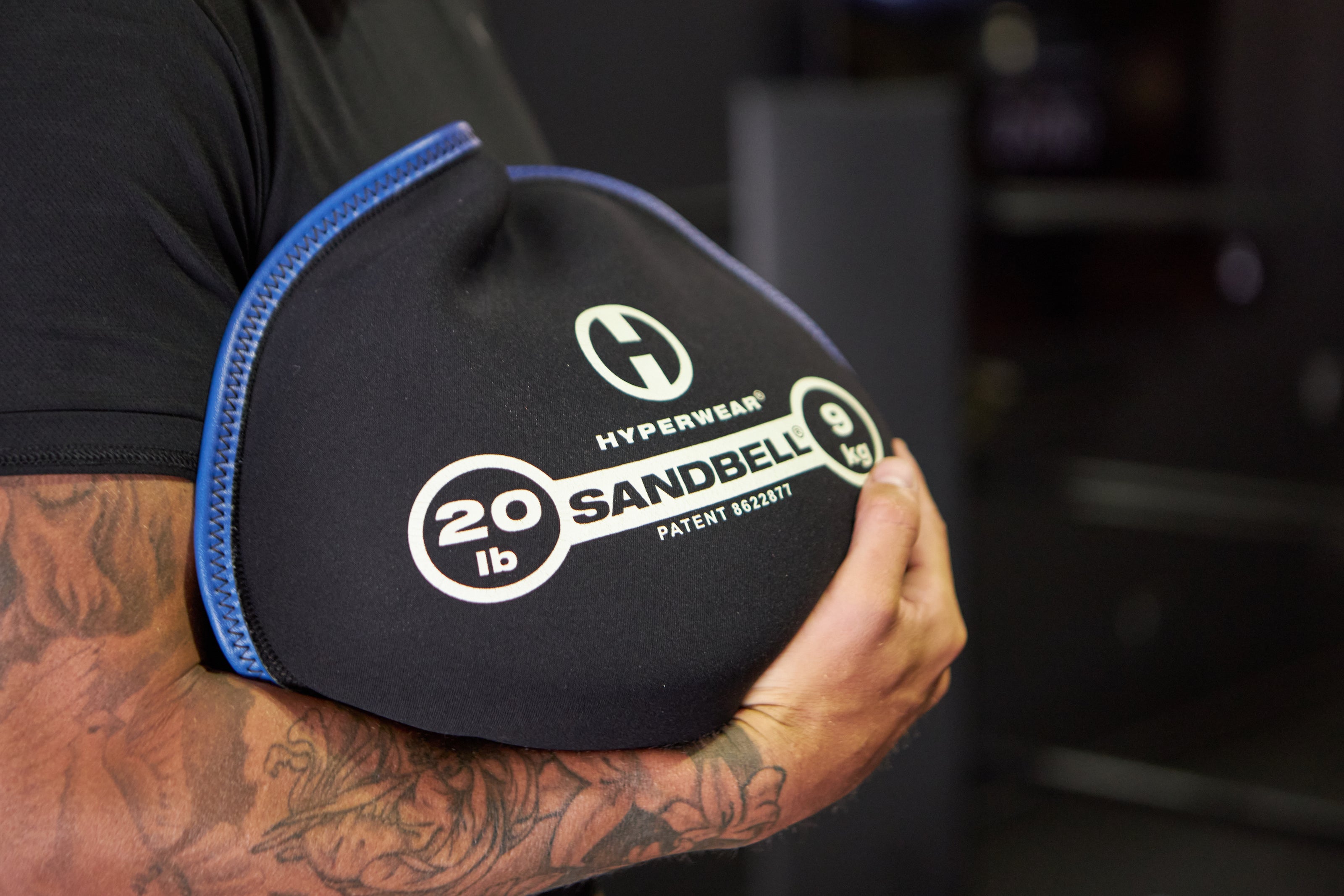 Close up picture of a 20 lb SandBell workout sandbag being held