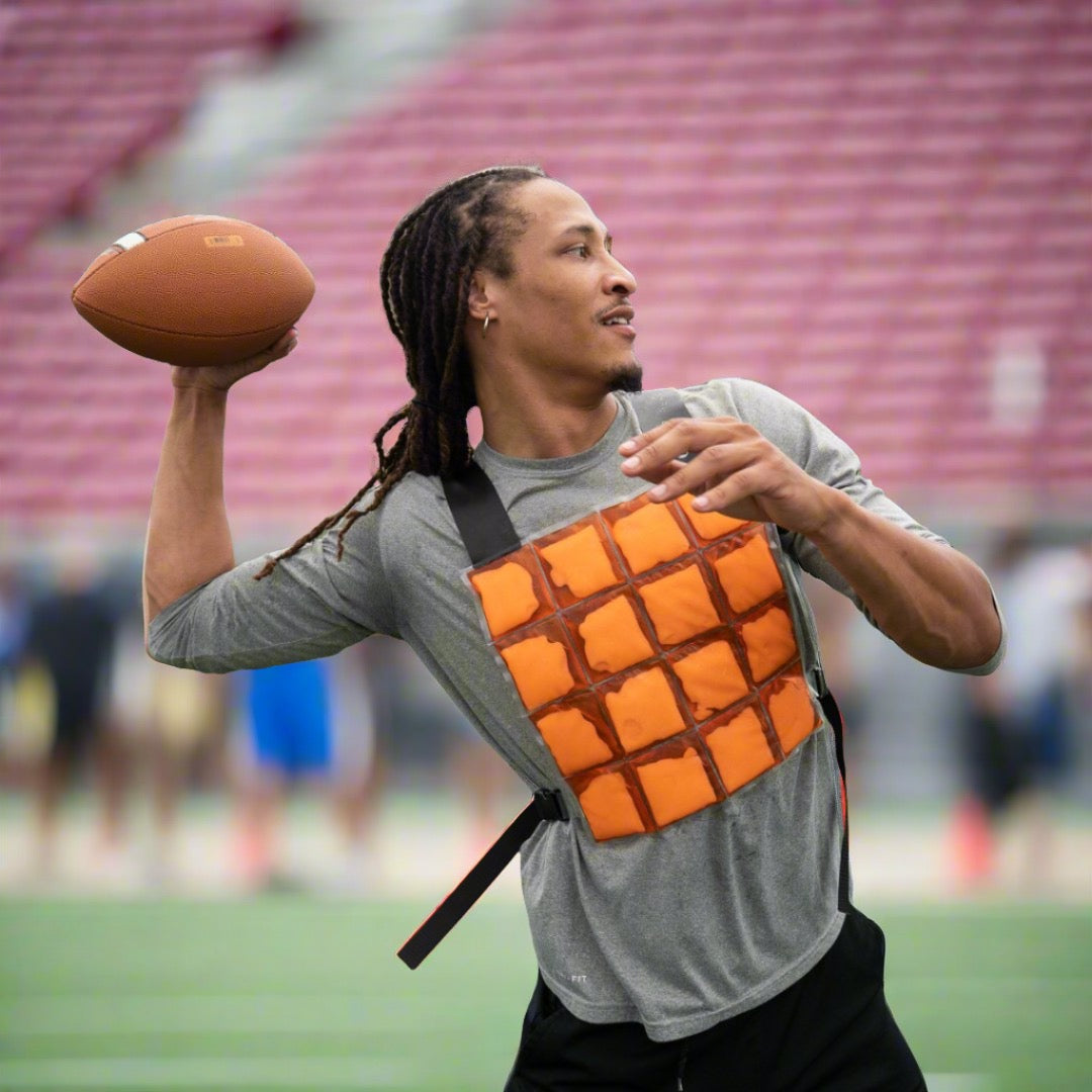 image of a football player wearing a CoolOver ice vest during practice in the heat