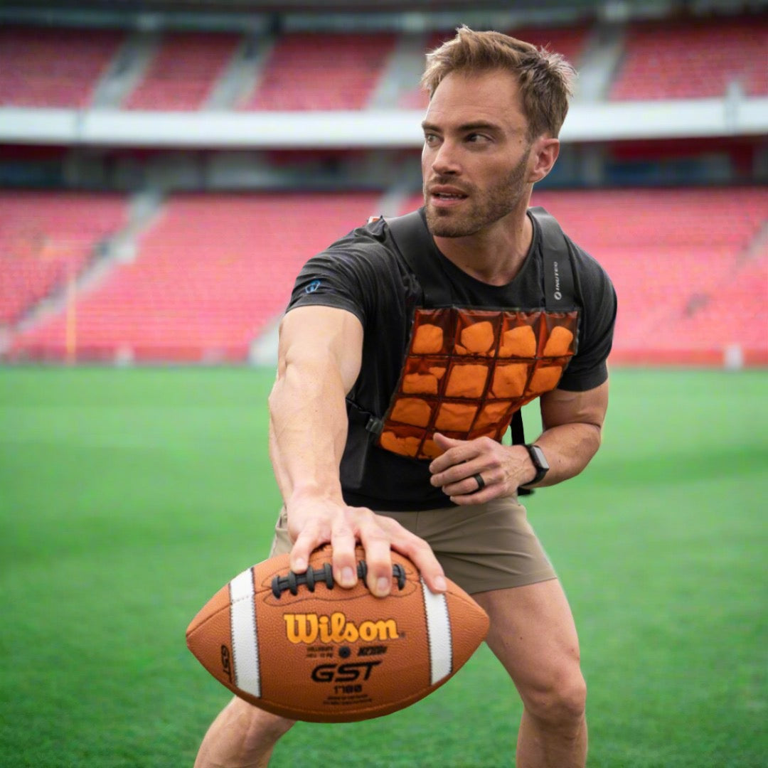 image of a football player wearing a cooling vest during practice to help prevent heat stroke