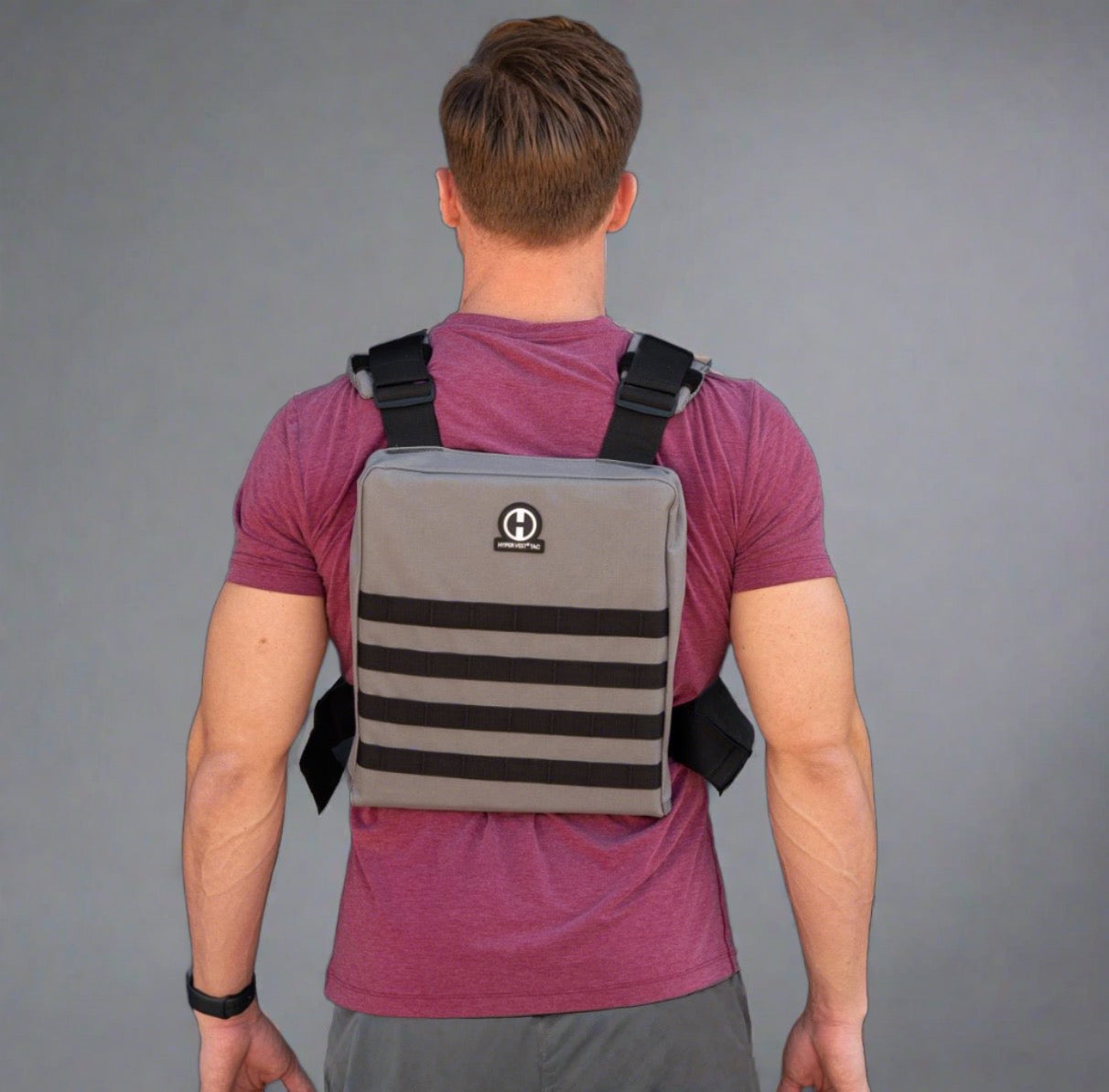 back view of male athlete wearing a Hyper Vest Tactical Weighted Vest