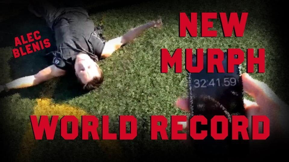 Photo of Alec Blenis on ground recovering after setting a MURPH World Record in a Hyper Vest ELITE weighted vest