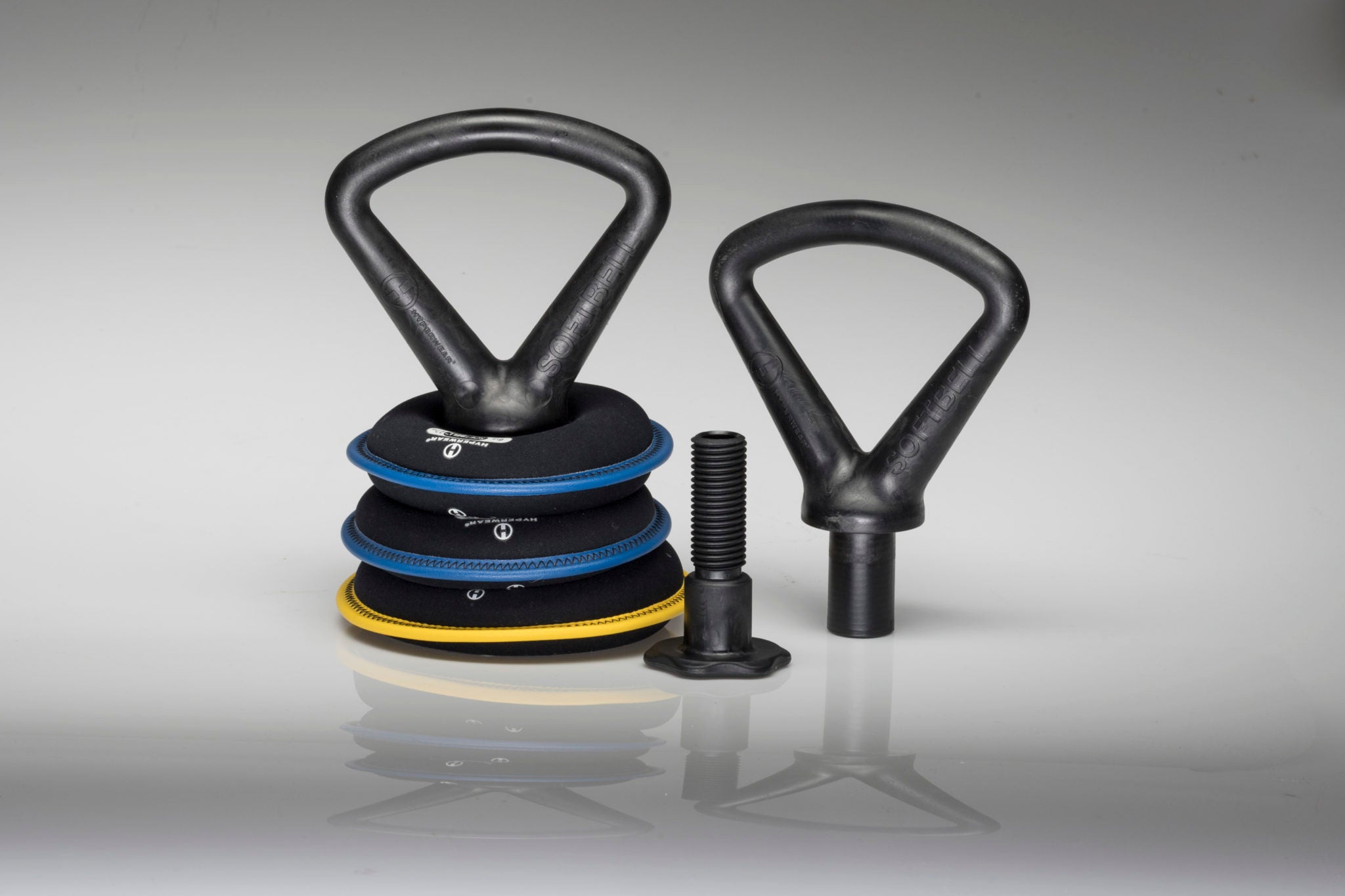 Product image of assembled soft kettlebell set next to the kettlebell handle for plates and bolt