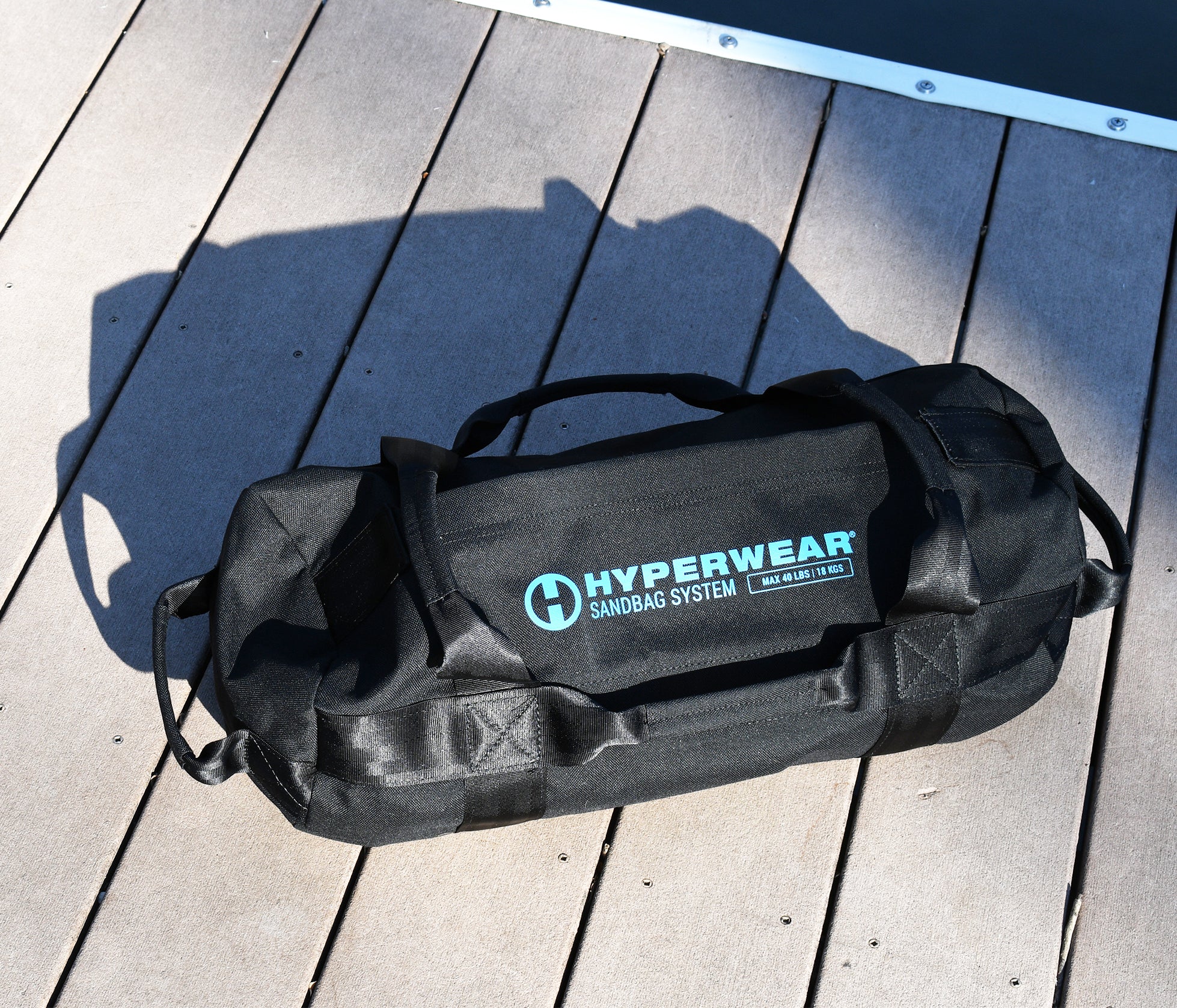 product image of filled hyperwear handled sandbag system workout sandbag outdoors on a deck