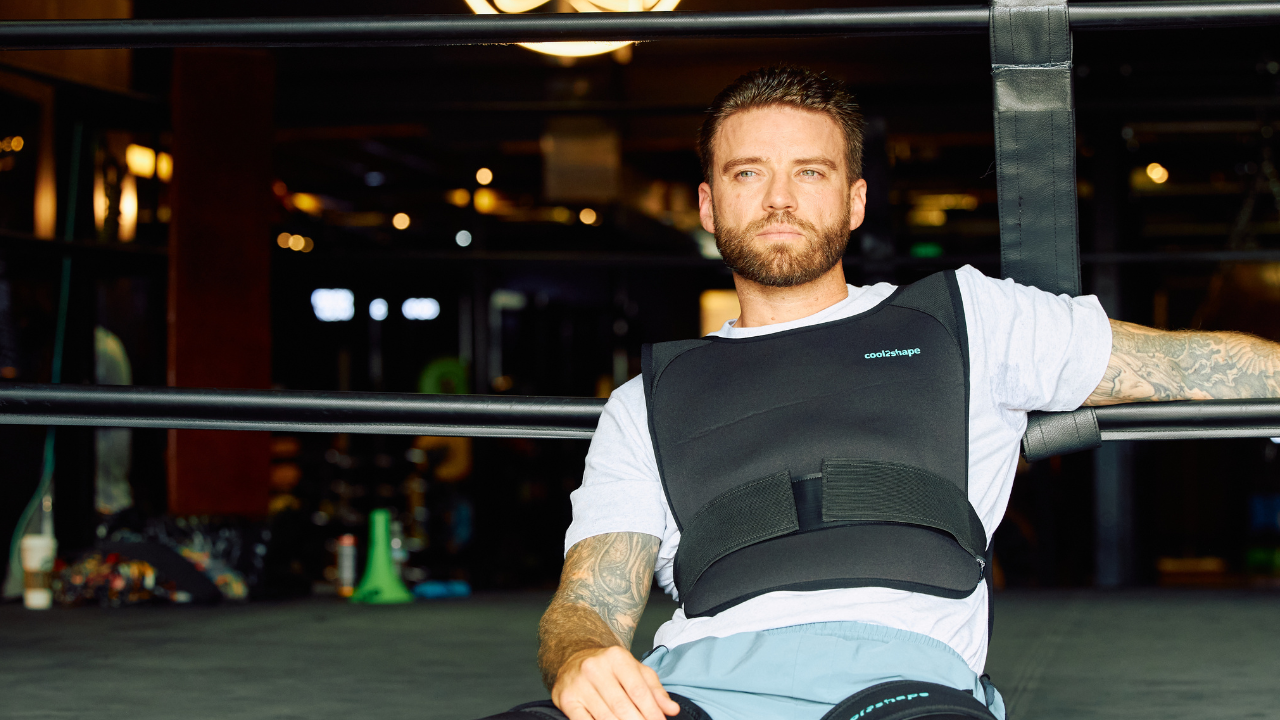 image of male model relaxing in gym wearing the cool2shape brown adipose tissue weight loss cooling vest