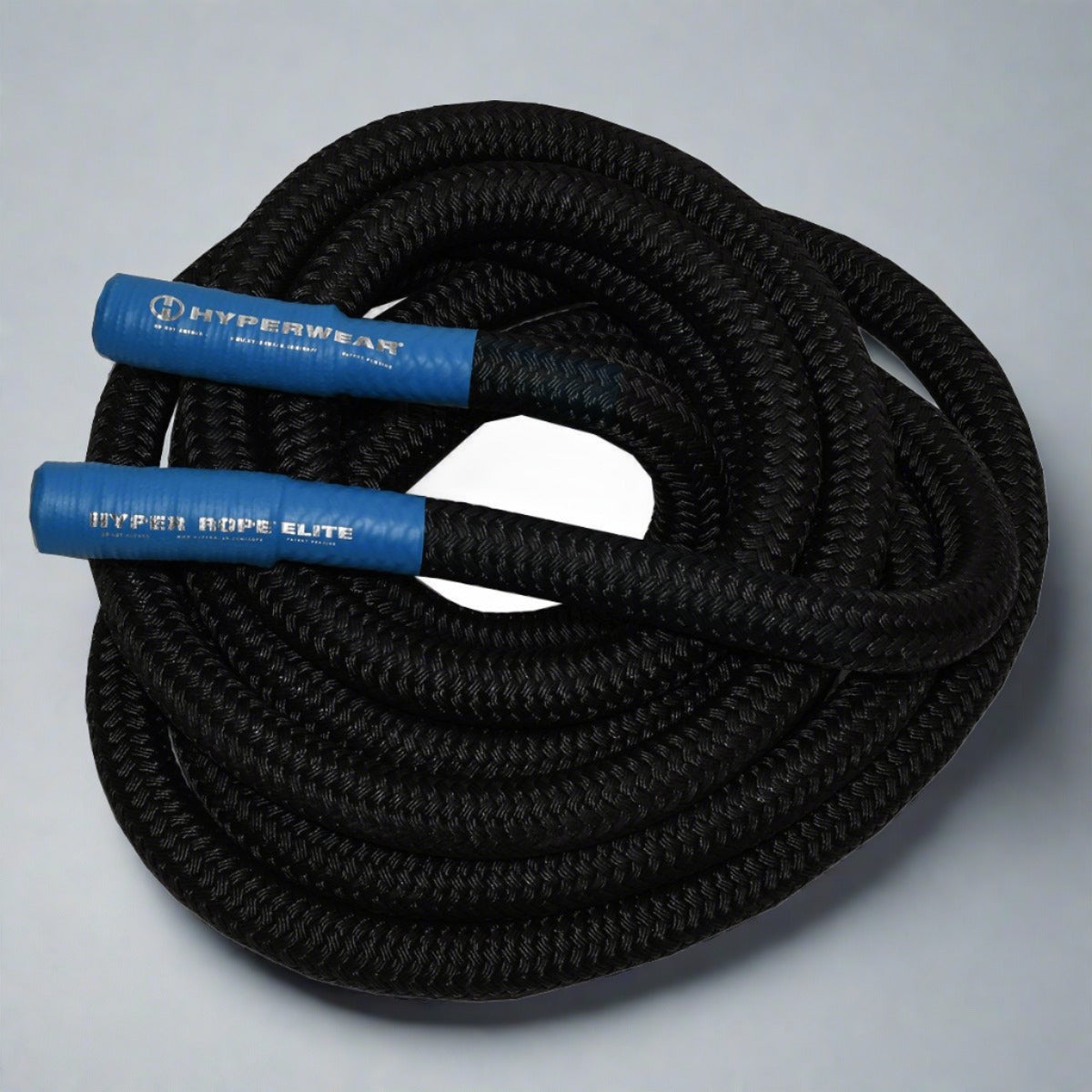 Product photo of a black braided hyper rope weighted battle rope with blue handles