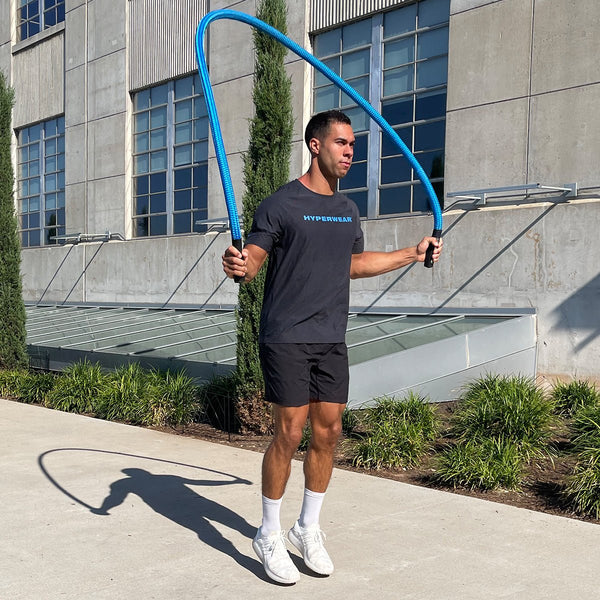 man jumping rope outdoors with Hyperwear Hyper Rope®: Heaviest Weighted Jump Rope for Intense Training 