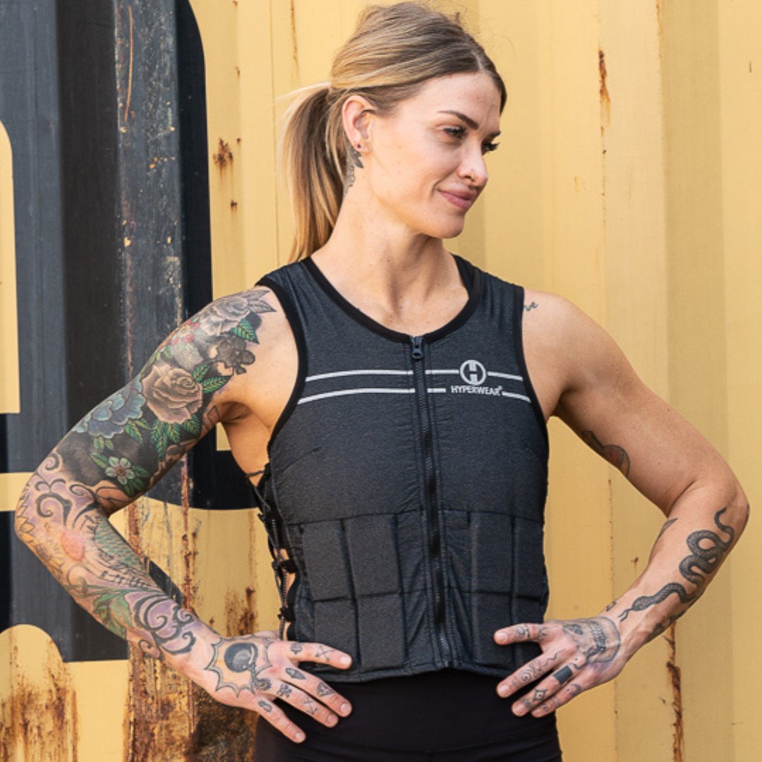 image of a female athlete modeling the Hyper Vest FIT women's weight vest at her gym