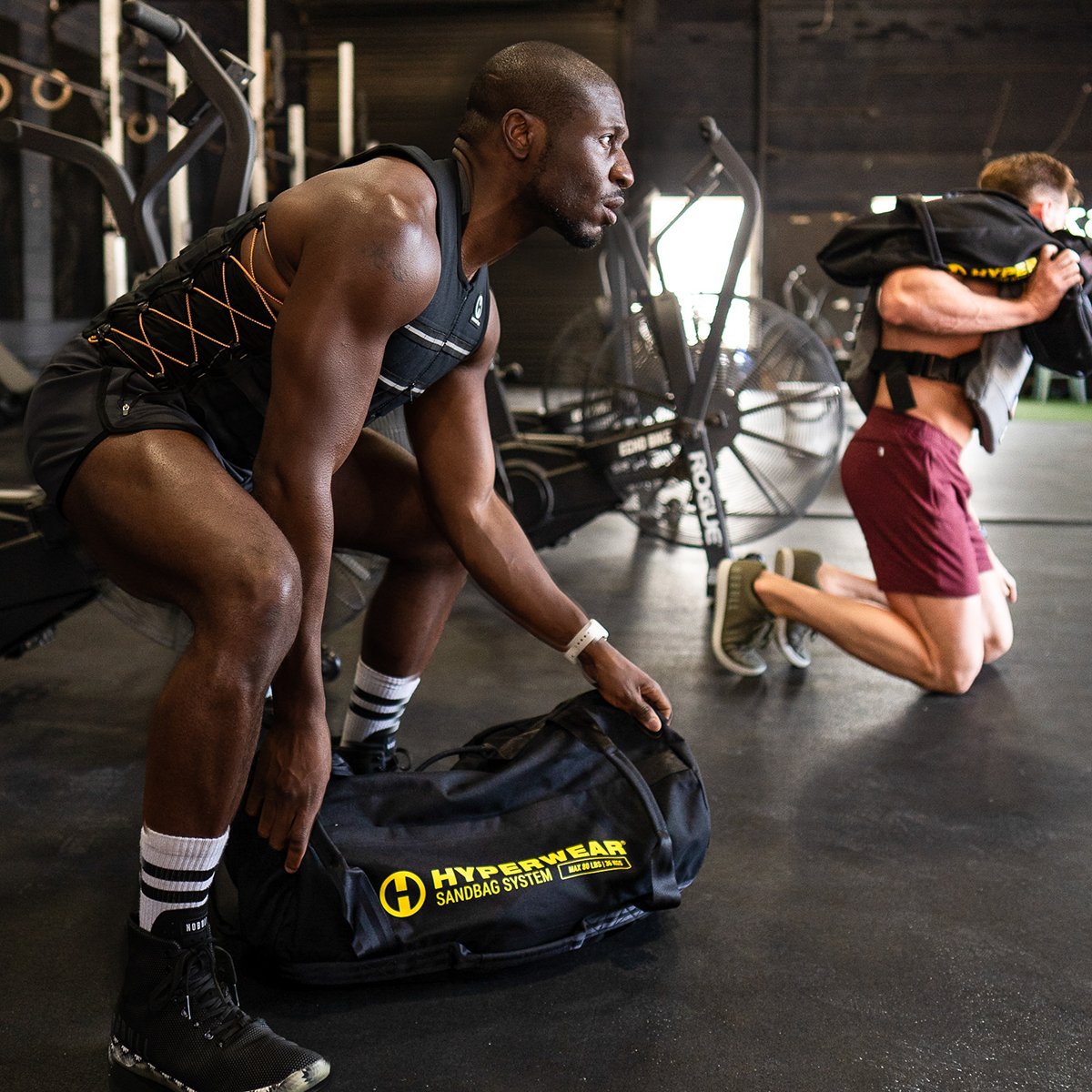 image of athletes training with hyperwear handled workout sandbags